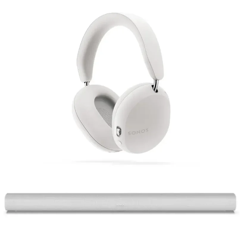 Sonos Ace Wireless Active Noise Canceling Over-Ear Headphones in white next to the Sonos Arc Premium Smart Soundbar, displayed on a minimalist living room console, highlighting sleek design and premium home audio setup.